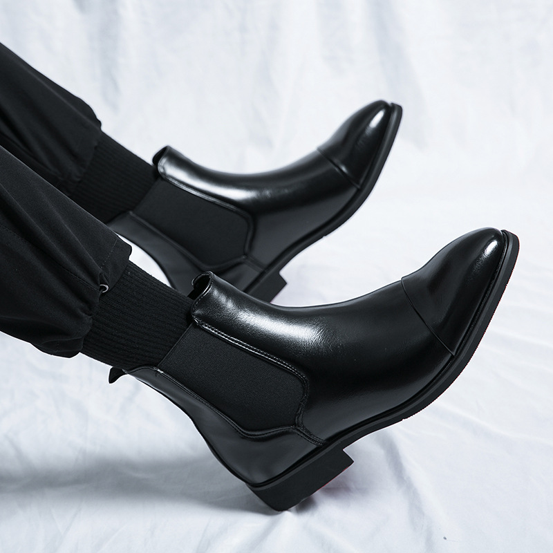 Comfortable men's slip-on Chelsea boots in black, perfect for both casual and dress occasions. Red sole.