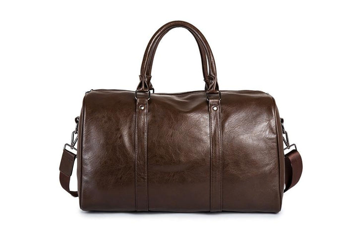 Overhead shot of an open men's leather duffel bag in brown, revealing roomy interior space for essentials
