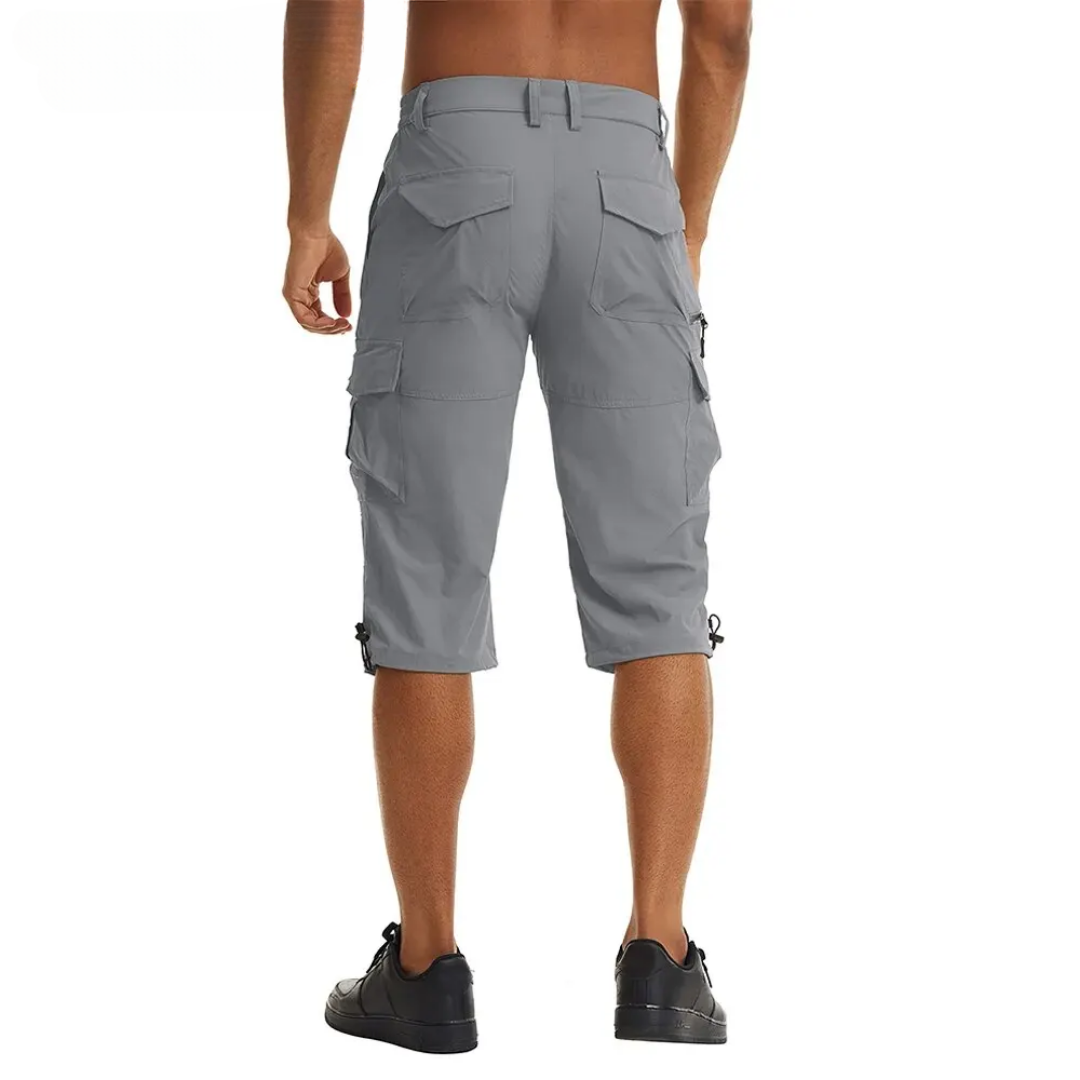 Close-up of men's blue lightweight cargo shorts with zipped pockets, ideal for outdoor activities and travel