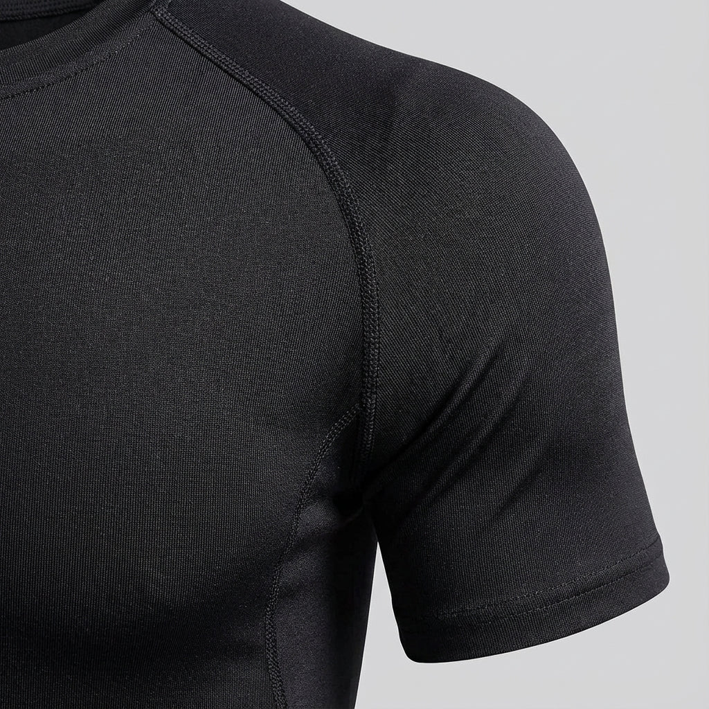 Man wearing long sleeve compression shirt, demonstrating flexibility for sports apparel