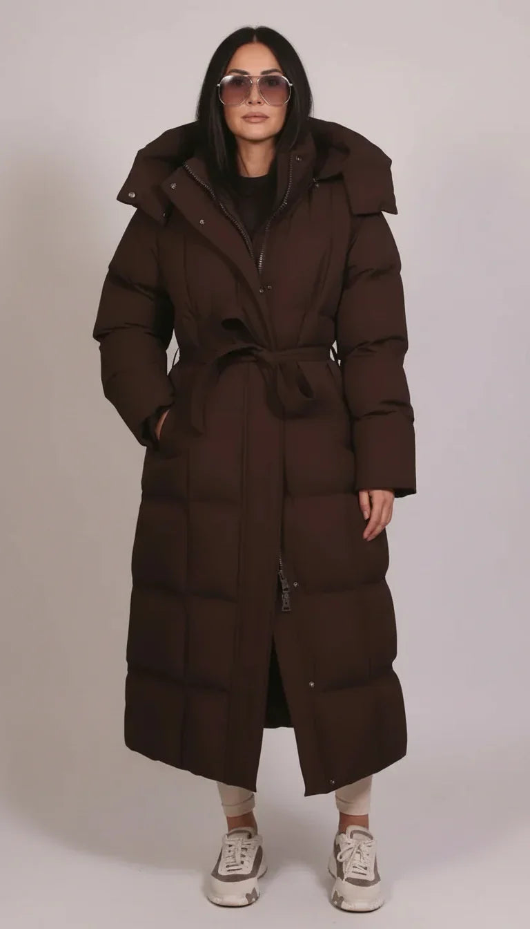 Weatherproof men's longline puffer jacket in black, ideal for cold winter outdoor wear & fashion.