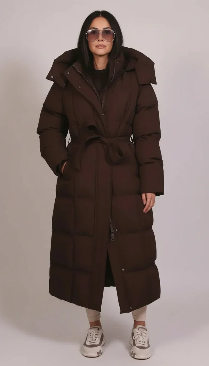 Weatherproof men's longline puffer jacket in black, ideal for cold winter outdoor wear & fashion.