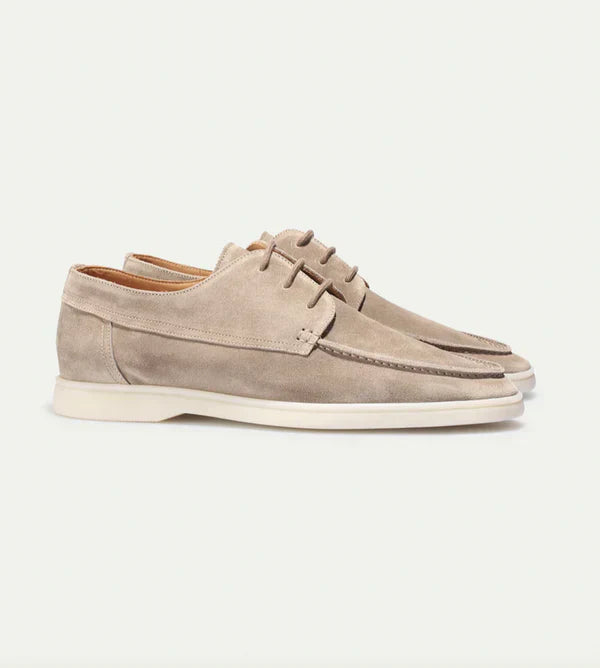 Men's black leather lace-up loafers paired with business attire, premium men's fashion shoes.