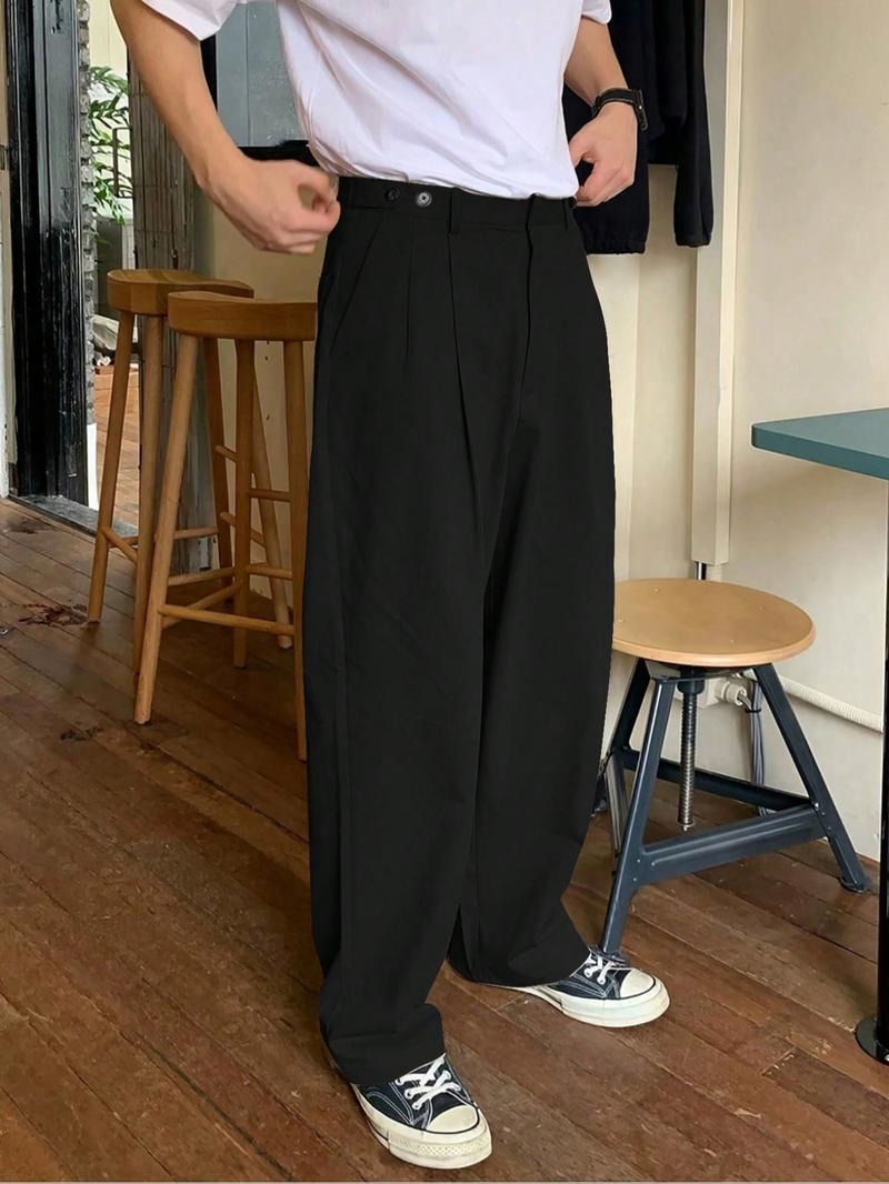 Men's black Napoli pleated wide-leg trousers, tailored for a relaxed, modern fit. Perfect for smart casual wear.