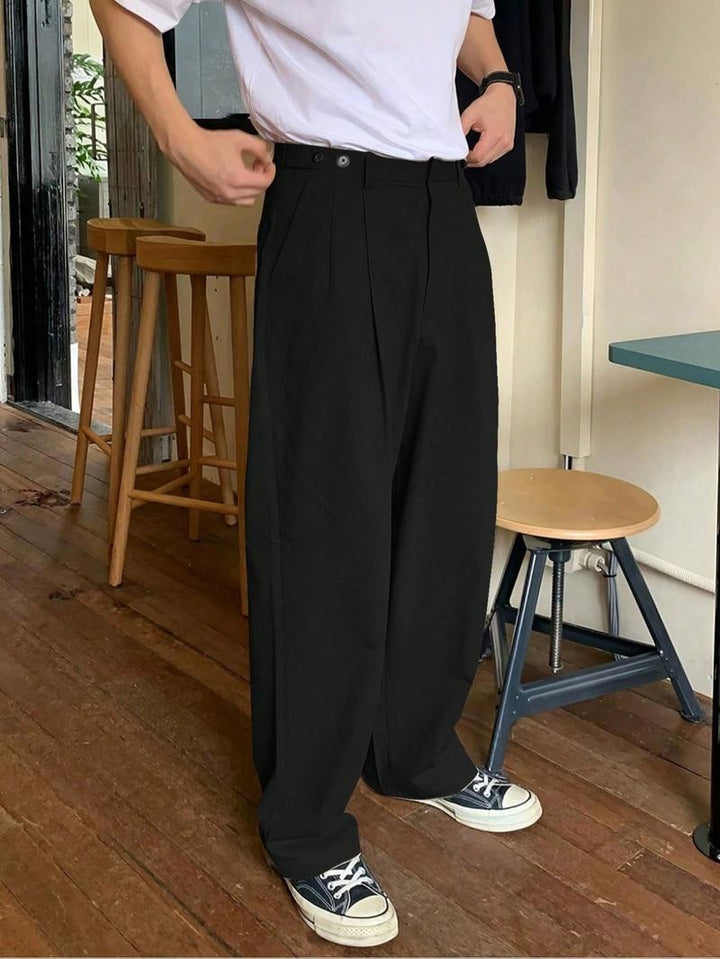 Men's black Napoli pleated wide-leg trousers, tailored for a relaxed, modern fit. Perfect for smart casual wear.