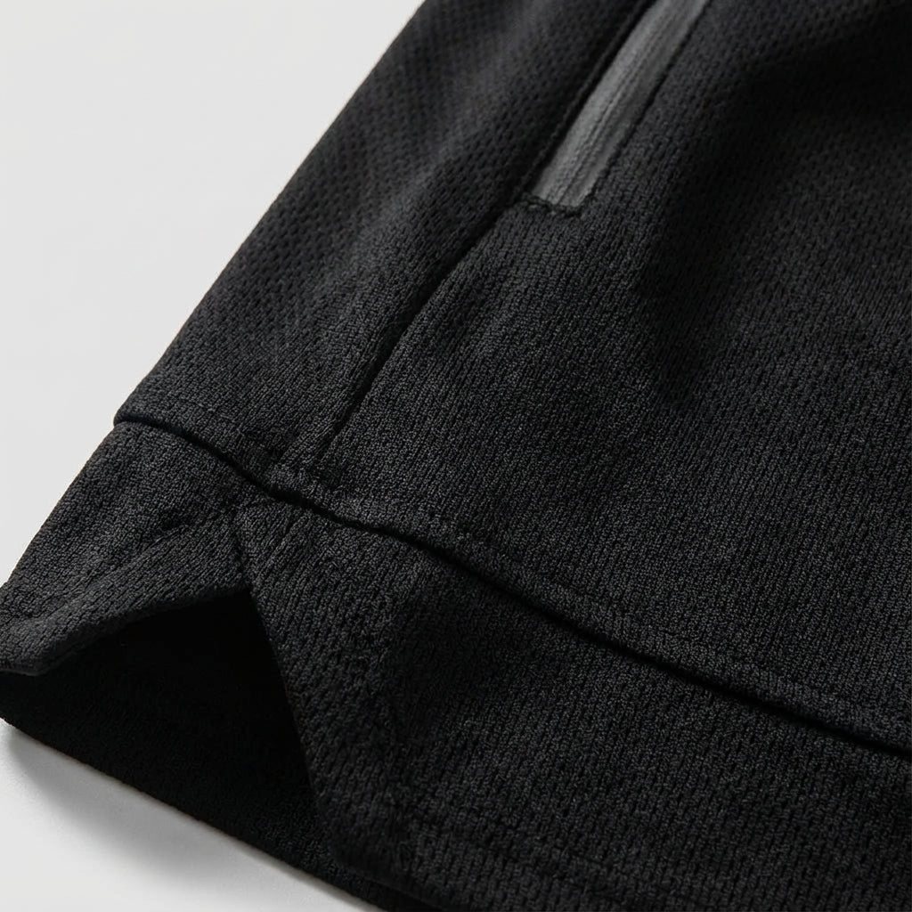 Close-up of men's sport shorts, showing durable fabric and convenient side pockets