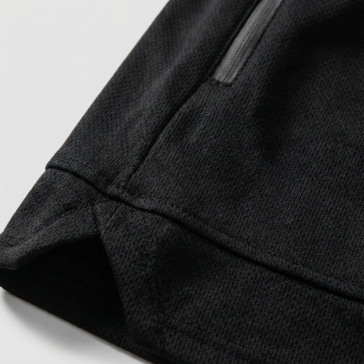 Close-up of men's sport shorts, showing durable fabric and convenient side pockets