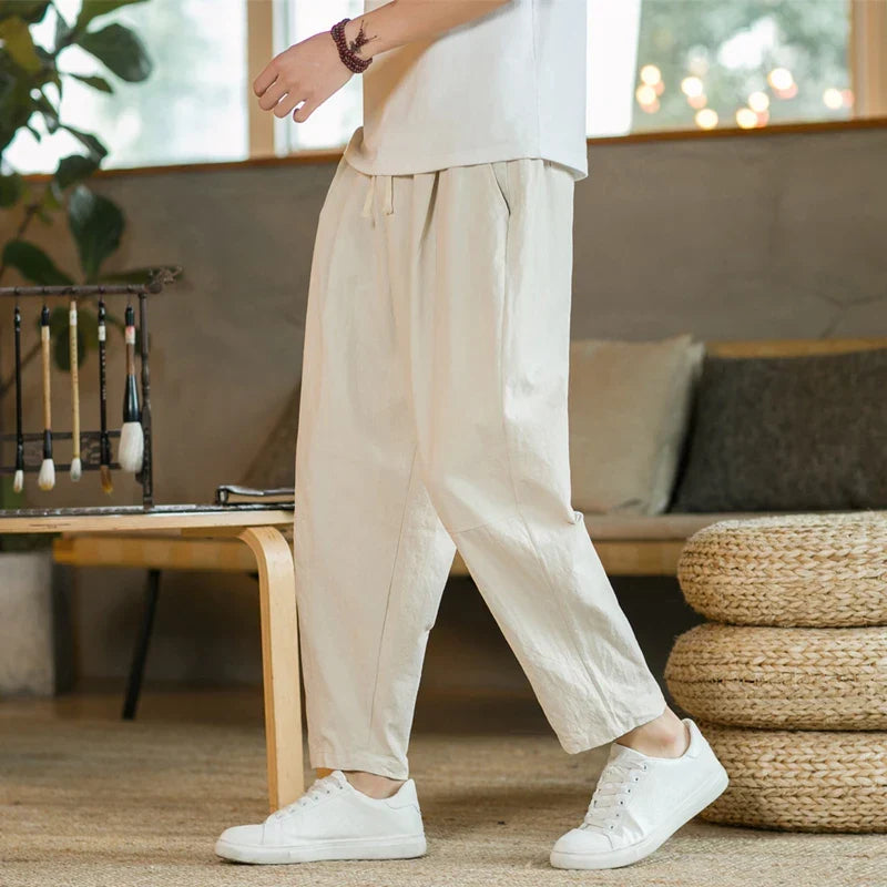 Beige men's relaxed fit casual drawstring pants, offering ultimate comfort for daily wear. Stylish mens bottoms.