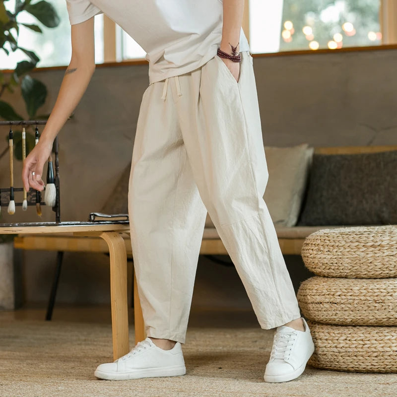 Men's relaxed fit casual drawstring pants. Comfortable and versatile bottoms, perfect for modern mens fashion.