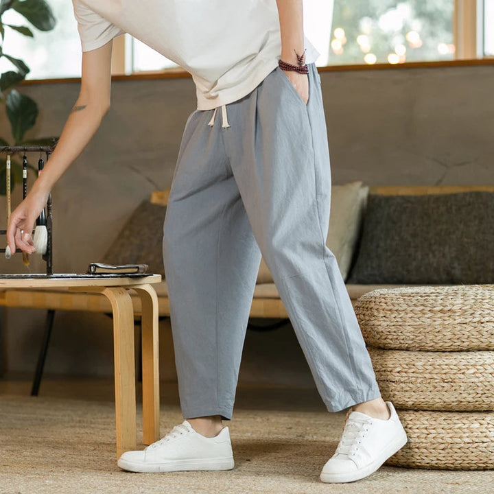 Navy blue men's relaxed fit casual drawstring pants. Easy-to-wear comfortable bottoms for daily fashion.