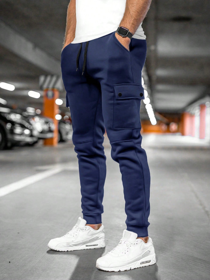 Sleek men's slim-fit casual trousers, doubling as streetwear joggers for active and relaxed days.
