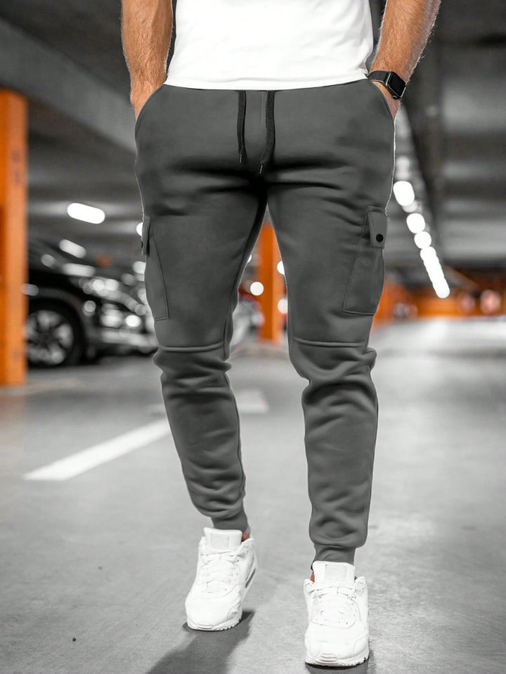 Men's streetwear joggers with tapered leg, slim fit, and practical pockets for urban style.