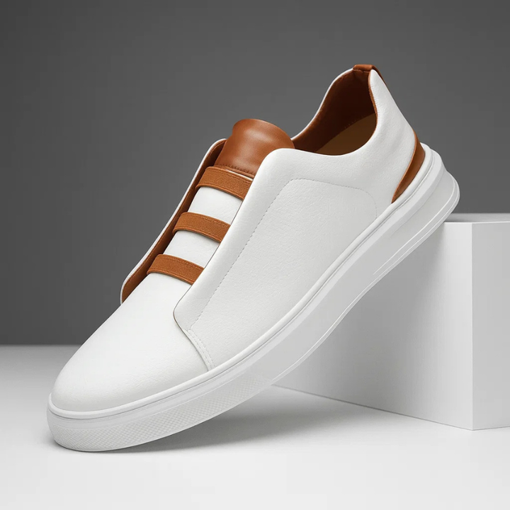 Men's black slip-on sneakers offering effortless style & comfort for everyday wear.