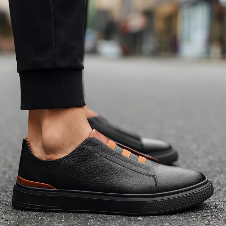 Sleek men's slip-on sneakers, combining minimalist design with effortless wearability.
