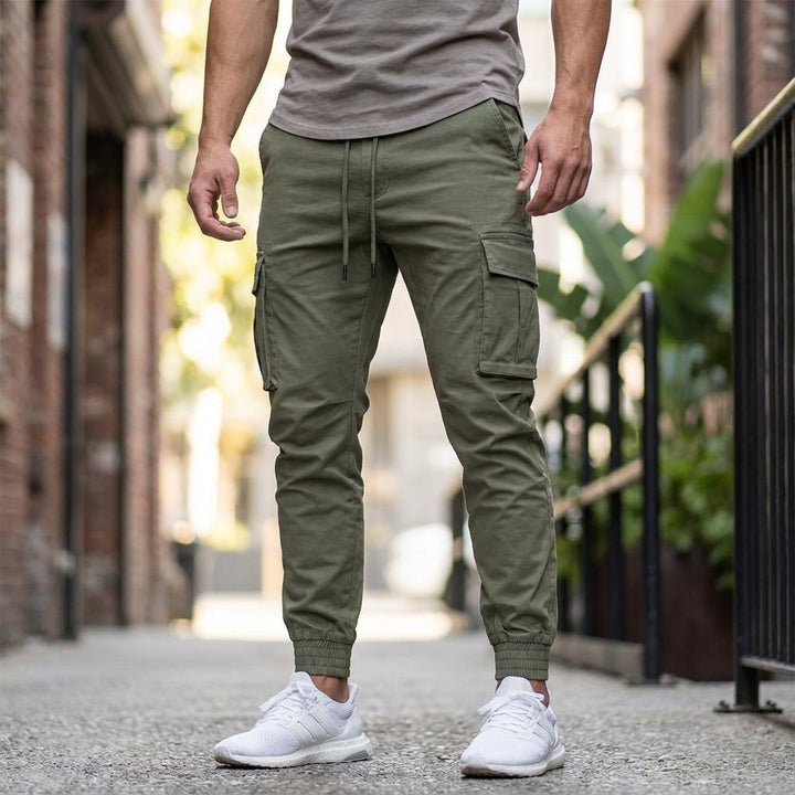 Men's black stretch joggers with cargo pockets, tapered fit, ideal for casual and athletic wear