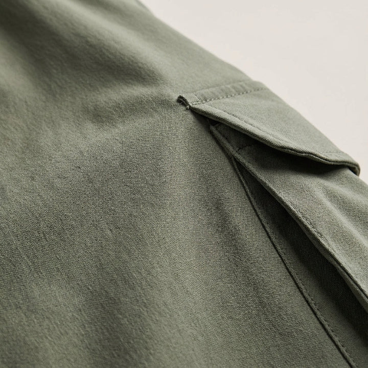 Close-up of men's stretch joggers with prominent side cargo pockets, perfect for everyday casual wear