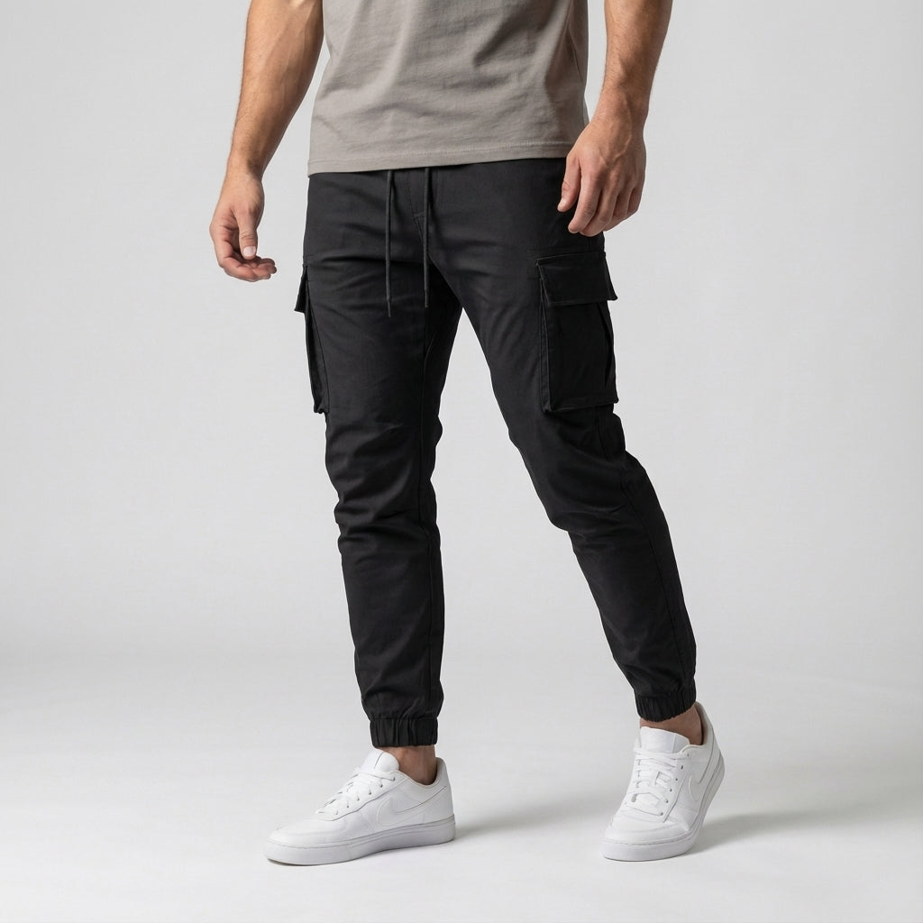 Men's stretch jogger pants in a neutral color with multiple cargo pockets, suitable for activewear