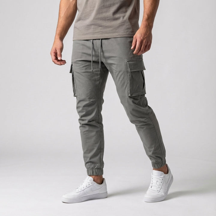 Versatile men's stretch pants with cargo-style pockets, designed for optimal movement and comfort