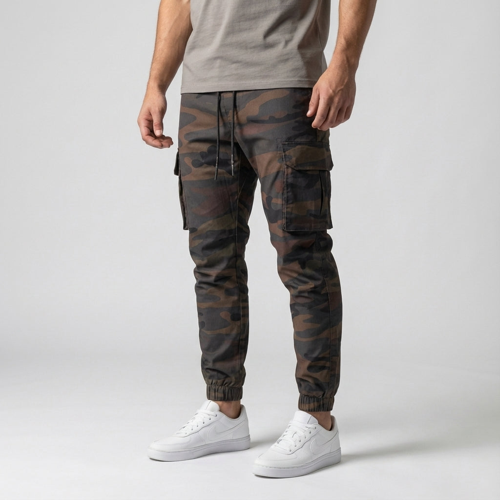 Detail shot of the elastic waistband and cargo pocket on men's stretch joggers, Melvin collection