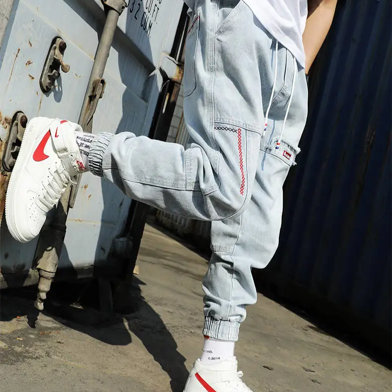 Grey men's tapered jogger pants, combining casual wear comfort with modern athletic style.