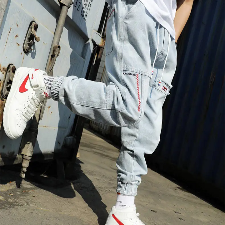 Grey men's tapered jogger pants, combining casual wear comfort with modern athletic style.