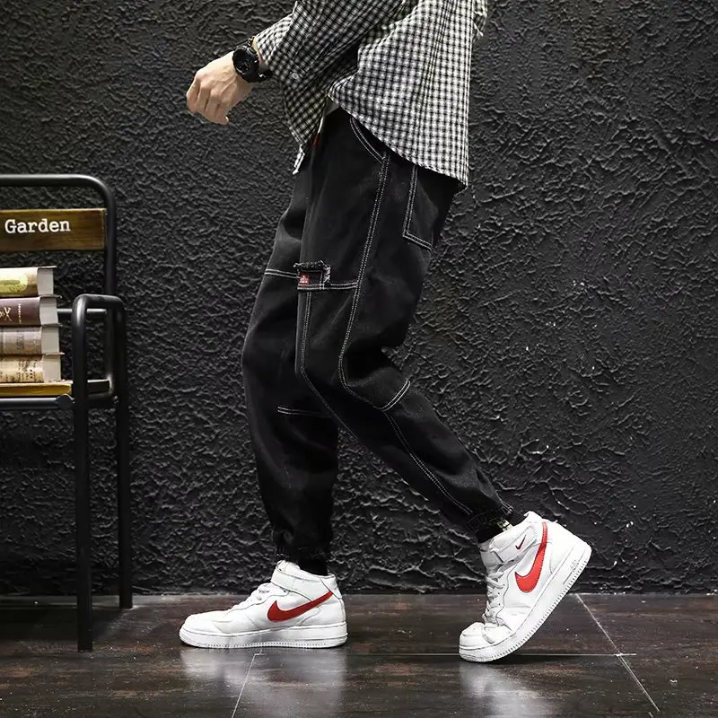 Man wearing men's tapered jogger pants, showcasing comfort & modern casual style for everyday use.