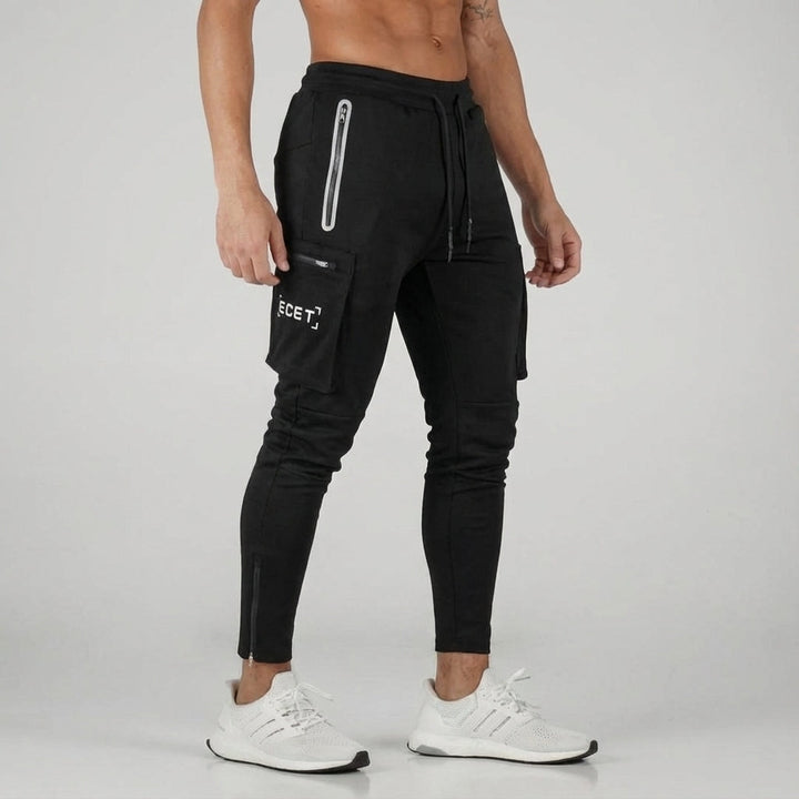 Close-up of men's tapered jogger pants showing zip pocket detail and comfortable fabric