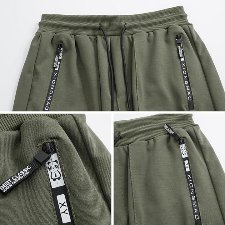 Modern men's black techwear joggers with multiple utility pockets, combining tactical & harem styles