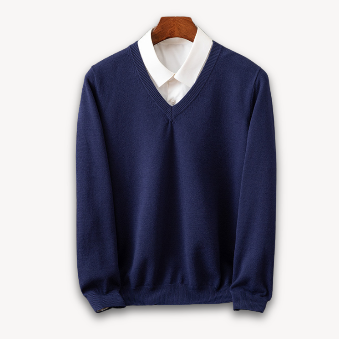 Versatile men's black V-neck sweater, a key layering piece. Slim fit, long sleeve for stylish modern apparel.