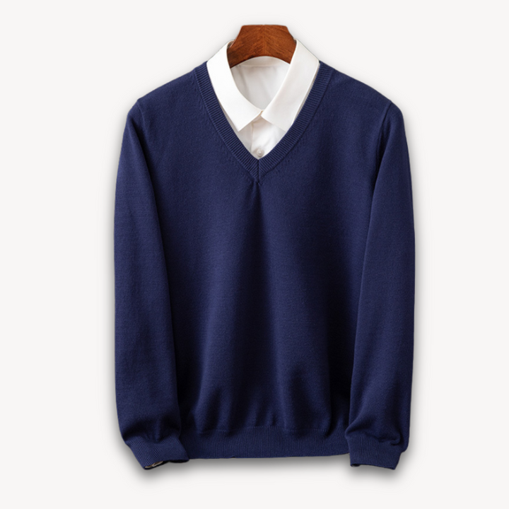 Versatile men's black V-neck sweater, a key layering piece. Slim fit, long sleeve for stylish modern apparel.