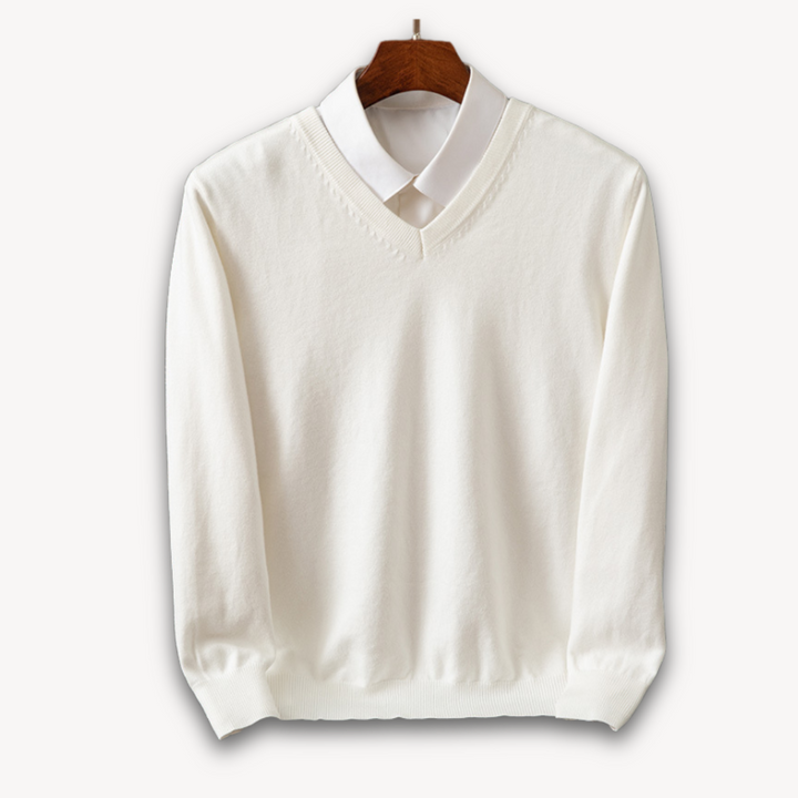 Modern man wearing a black V-neck sweater. Slim fit, long sleeve, ideal for stylish men's casual fashion.