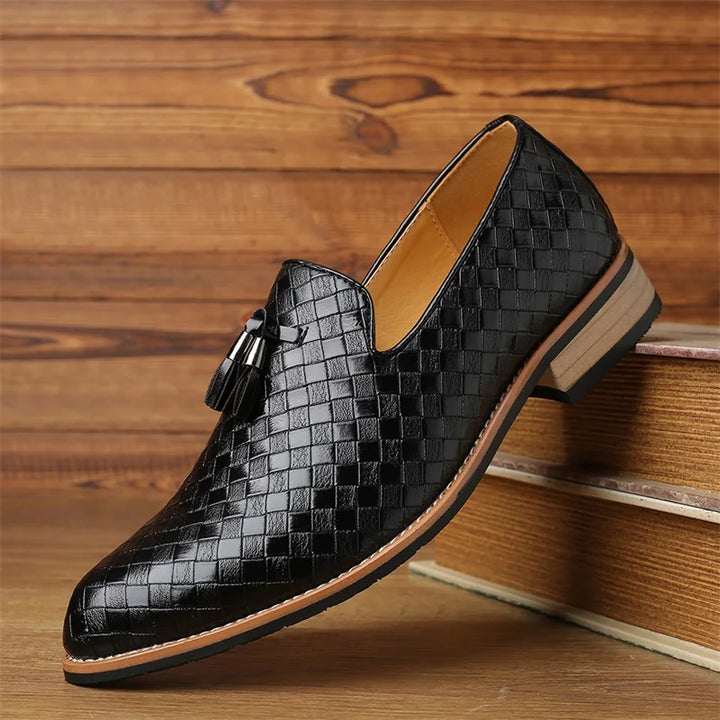 Men's black woven tassel dress loafers, perfect for formal and smart casual wear.