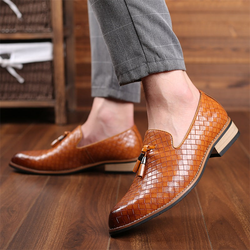 Black woven design tassel loafers for men, classic and comfortable formal shoes.