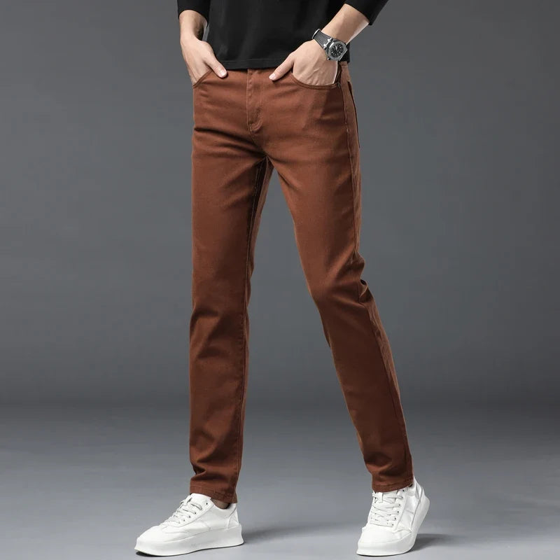 Red men's stretch denim jeans, designed for high comfort, flexibility, and wrinkle resistance, ideal for casual.