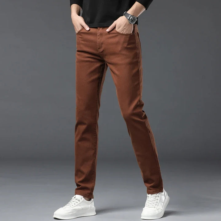 Red men's stretch denim jeans, designed for high comfort, flexibility, and wrinkle resistance, ideal for casual.
