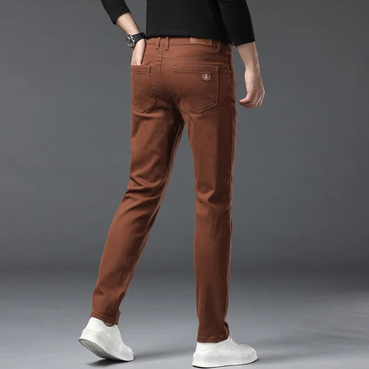Brown men's comfort denim jeans, high-stretch and versatile for everyday fashion and casual outfits.