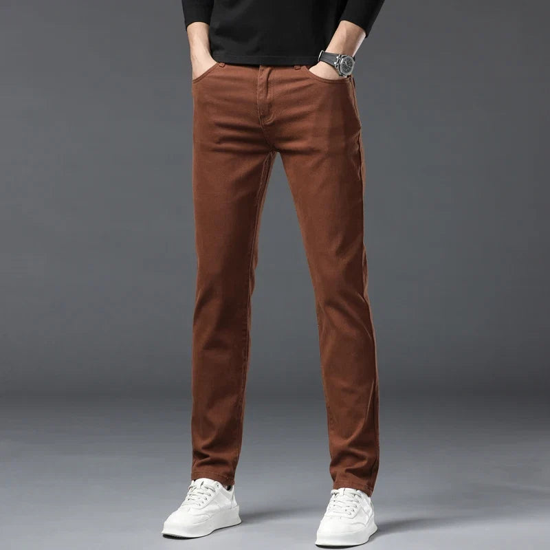 Trendy pink men's high-stretch denim jeans, offering superior comfort and flexibility for modern casual fashion.