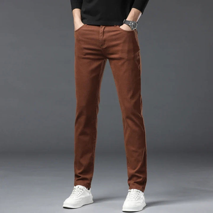 Trendy pink men's high-stretch denim jeans, offering superior comfort and flexibility for modern casual fashion.