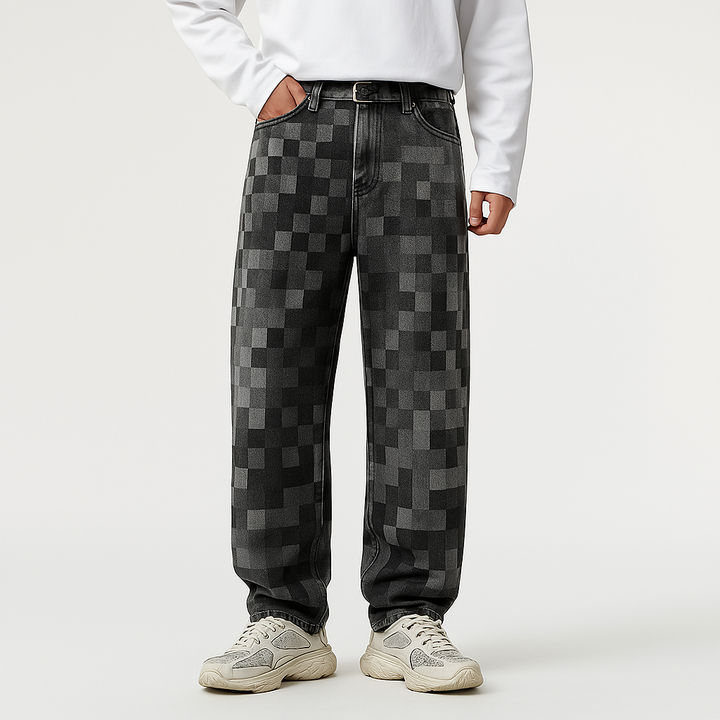 Black men's casual jeans with a mosaic pixel fade. Relaxed straight fit, streetwear aesthetic.