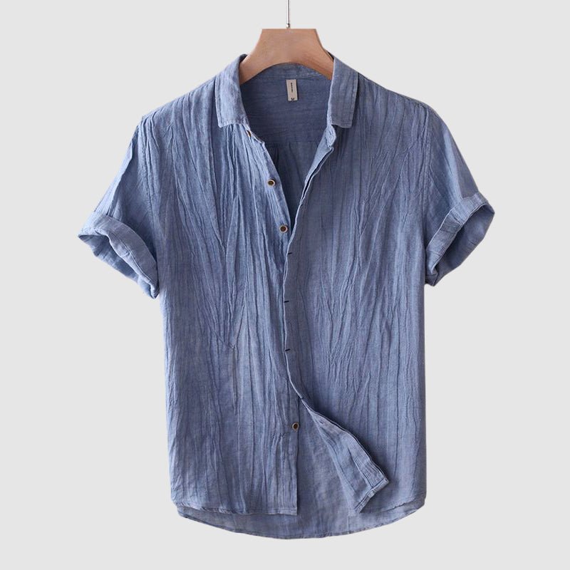 Casual men's short sleeve shirt with unique crinkle texture. Perfect button-down for summer fashion.