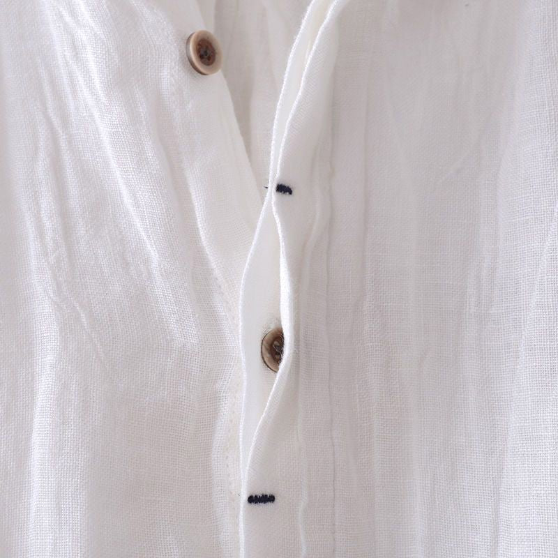 Full view of a man wearing a stylish, relaxed fit crinkle Bologna short sleeve button-down shirt.