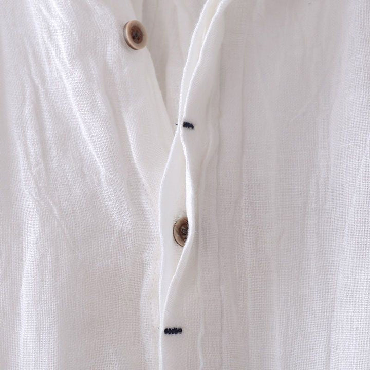 Full view of a man wearing a stylish, relaxed fit crinkle Bologna short sleeve button-down shirt.