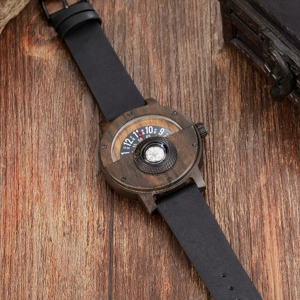 Close-up of men's wood watch with an embedded compass dial and a rich brown leather strap.