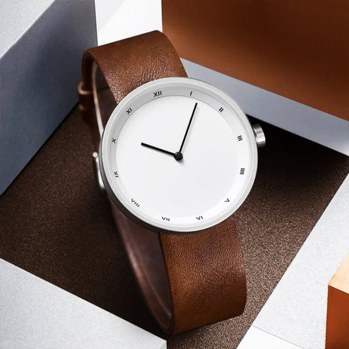 Minimalist Bradley men's quartz watch, featuring a sleek silver dial and premium black leather band. Modern timepiece.