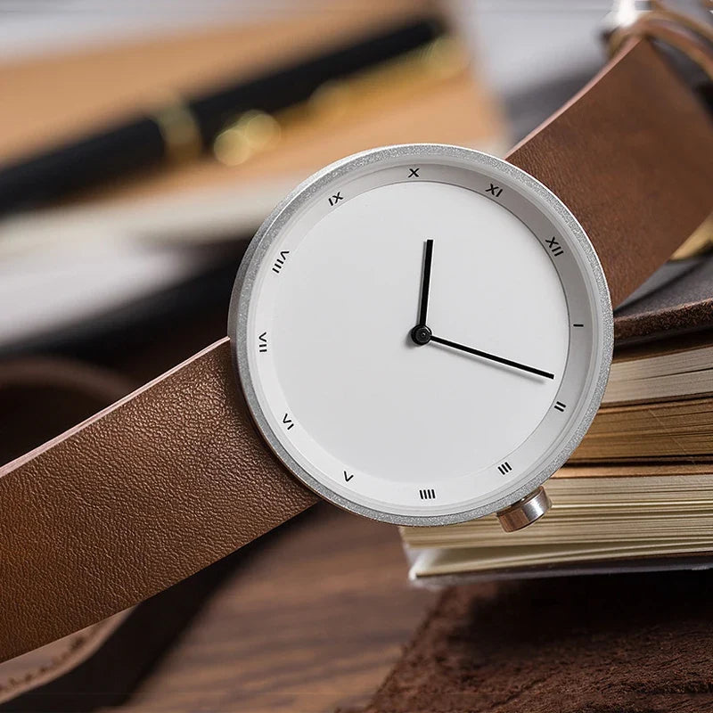 Close-up of a men's Bradley dress watch, highlighting the fine leather strap and classic quartz movement dial.
