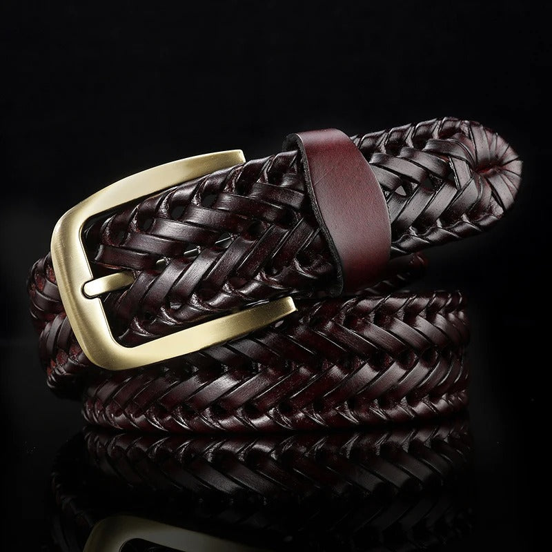 Close-up of the intricate braided full-grain leather texture of a men's stylish adjustable belt.