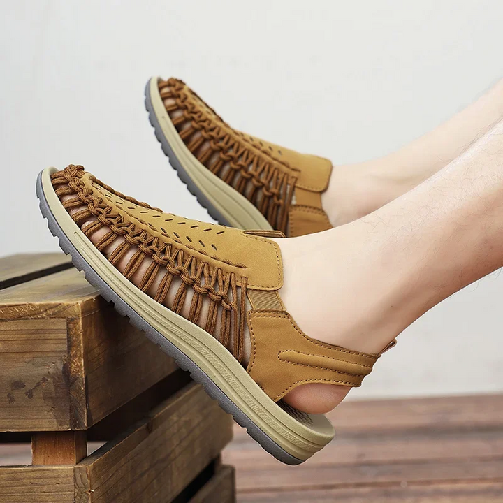 Breathable open-toe men's beach sandals, great for summer travel, sandy shores & all-day comfort.