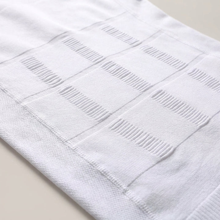Close-up of Frederick men's breathable compression tank top, highlighting seamless fabric and posture correcting design.