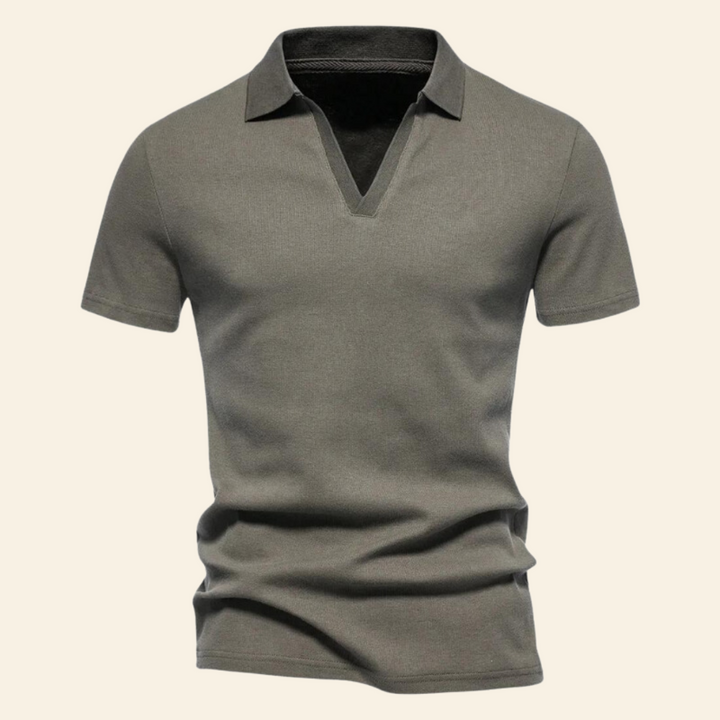 Man wearing a stylish slim-fit cotton V-neck polo, perfect for a versatile men's fashion statement.