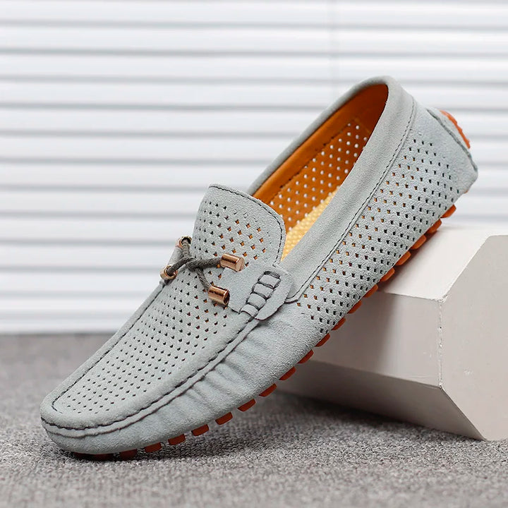 Durable men's breathable perforated leather slip-on shoes, perfect for any occasion.